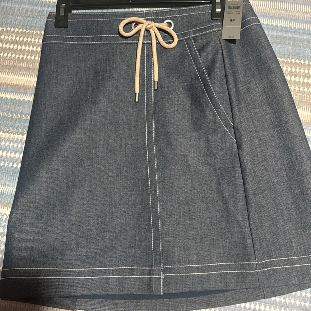 NWT Ann Taylor denim skirt. Size 8P zips in back has pockets, great for summer!